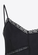 توب غير متماثل من الحرير بحواف من الدانتيل