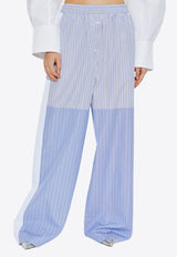 بنطال مُقلّم بقَصة ساق واسعة