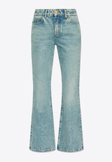 جينز واسع من الأسفل بشعار مُطرّز