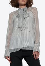 بلوزة شفافة بنمط بولكا دوت وربطة عنق