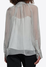 بلوزة شفافة بنمط بولكا دوت وربطة عنق