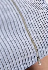 تنورة بحبكة مُضلّعة بطول منتصف الساق بسحّاب