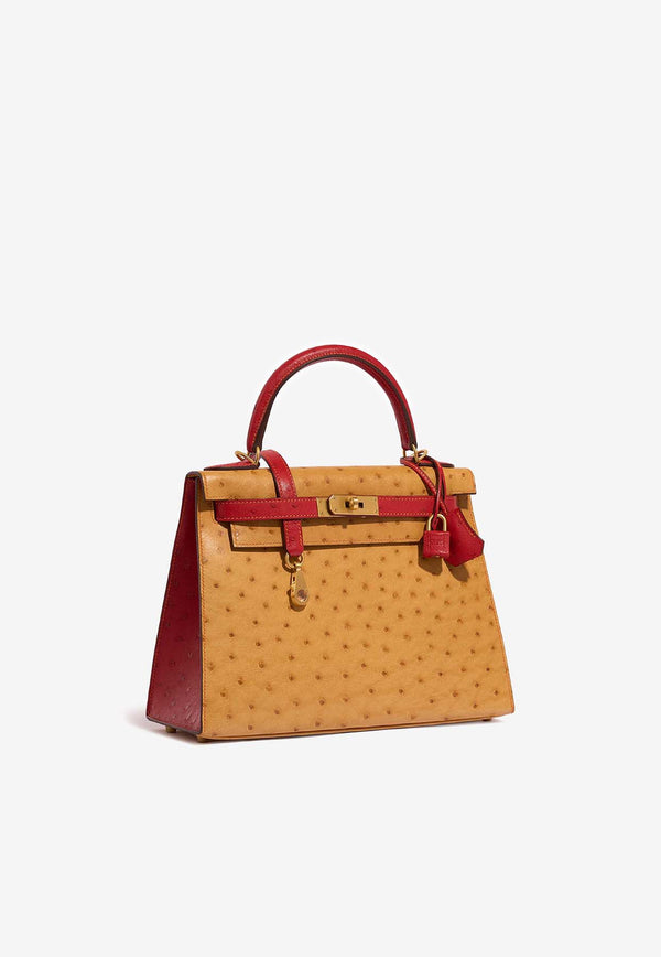 Kelly 28 in Gold and Rouge Vif Ostrich Leather with Brushed Gold Hardware