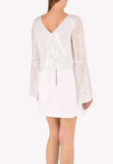 توب مُزين بالترتر بأكمام واسعة عند الأطراف