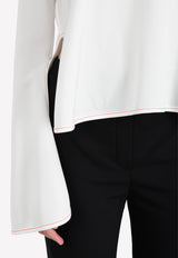 توب بروتوس بأكمام واسعة من الأسفل