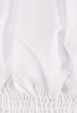 توب قصير بأكتاف متدلية وأكمام منفوخة