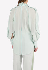 توب من الحرير بياقة مكشكشة وأكمام منفوخة