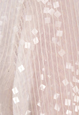 توب مُزين بالترتر بأكمام واسعة عند الأطراف