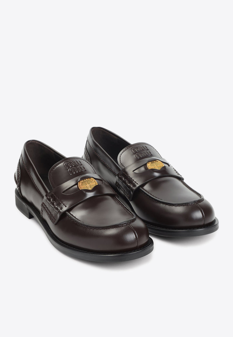 Embossed Logo Penny Loafers in Brushed Leather
