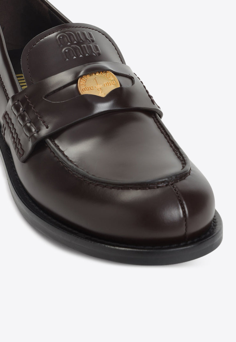 Embossed Logo Penny Loafers in Brushed Leather