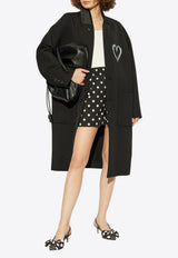 Coat with heart-shaped print