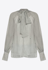 بلوزة شفافة بنمط بولكا دوت وربطة عنق