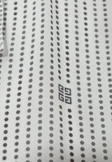 بلوزة شفافة بنمط بولكا دوت وربطة عنق