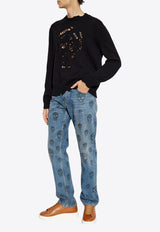 كنزة برقبة دائرية وشعار جمجمة مُمزق