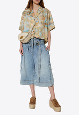 قميص إيلومنيت واسع قصير الأكمام