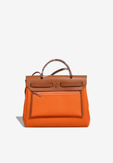 Hermès Herbag 31 in Orange Minium Toile and Fauve Vache Hunter Leather with Palladium Hardware