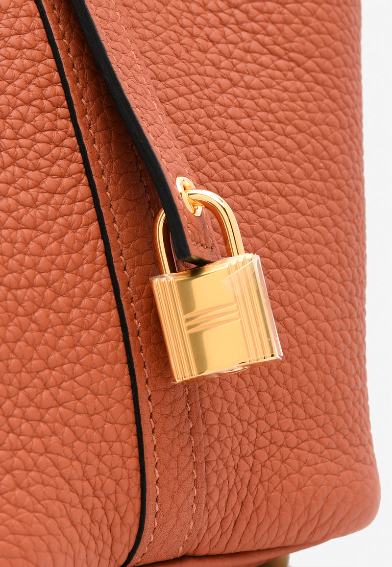 حقيبة بيكوتين لوك 18 من جلد التوريلون كليمنس بلون كويفر مع أجزاء معدنية ذهبية