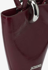Jacquemus Le Petite Bambola Asymmetric Bag Bordeaux 25HBAW00389AC20C01490_45594805-8b8e-45b5-a6bf-6711c241d4b6