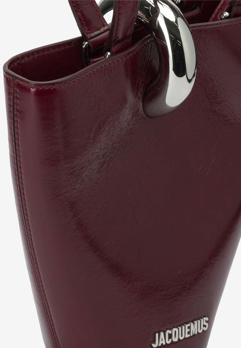 Jacquemus Le Petite Bambola Asymmetric Bag Bordeaux 25HBAW00389AC20C01490_45594805-8b8e-45b5-a6bf-6711c241d4b6