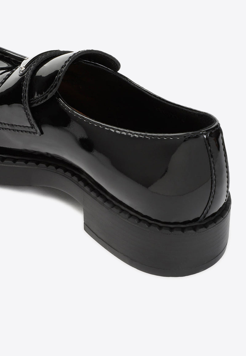 حذاء لوفرز بشعار الماركة مصنوع من الجلد اللامع